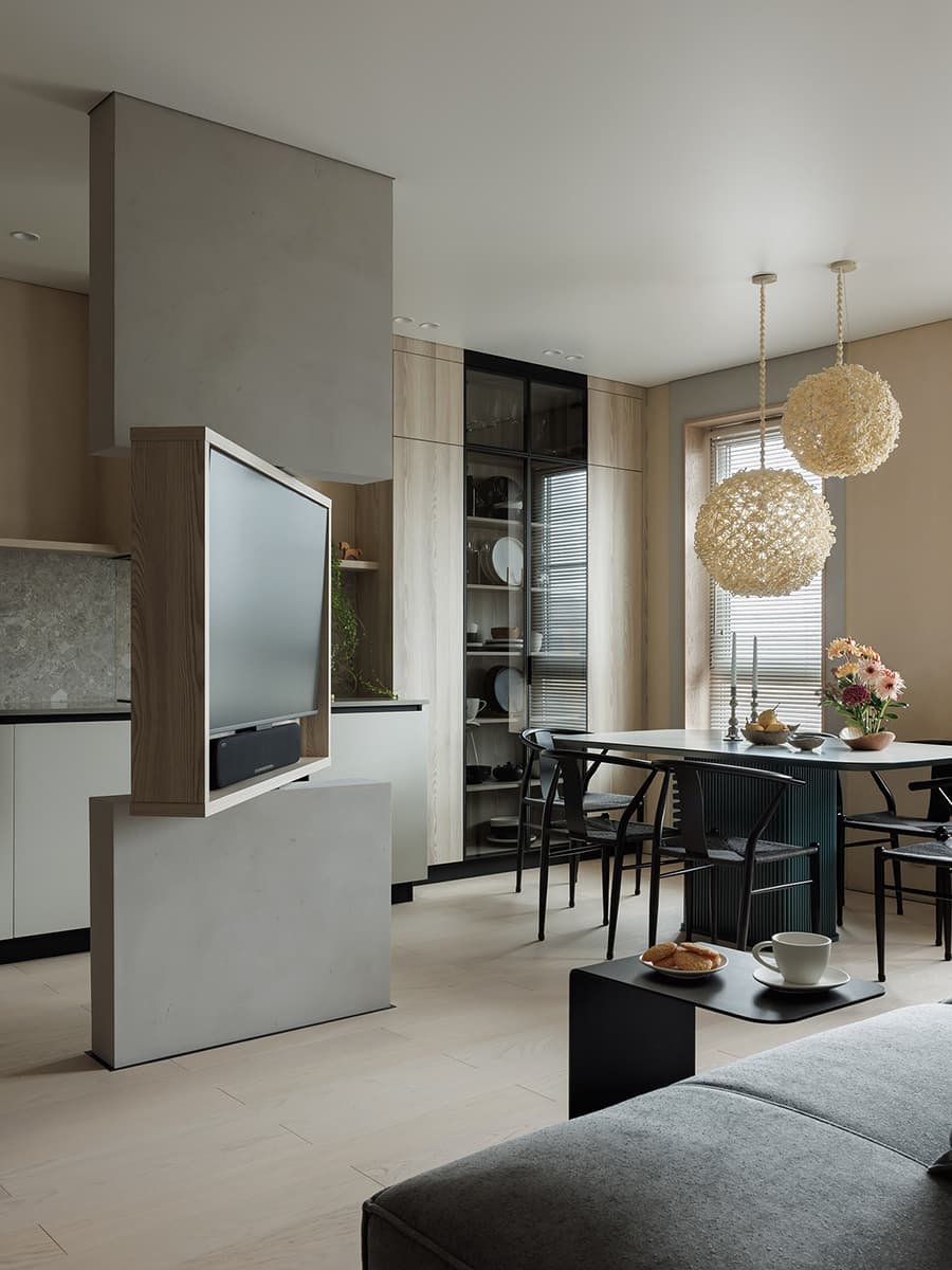 Поворотный телевизор, скрытое хранение и отсылки к джапанди в интерьере для психолога — проект Анны Тюленевой